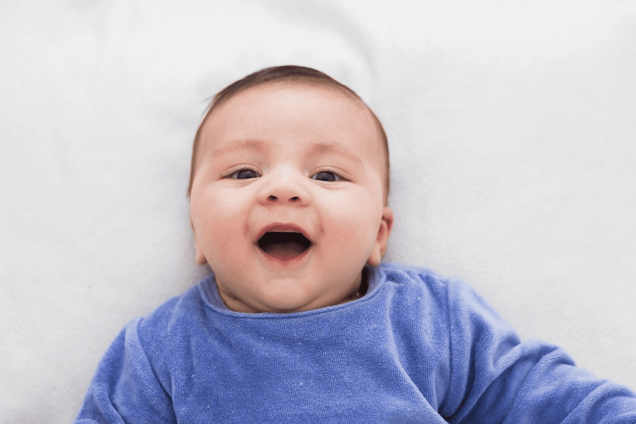 A toddler smiling